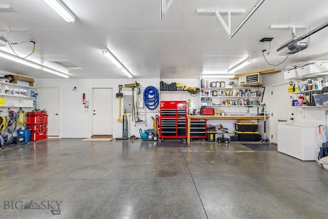 1708 Drummond Blvd, Belgrade, MT 59714 - garage with a workshop area and a garage door opener