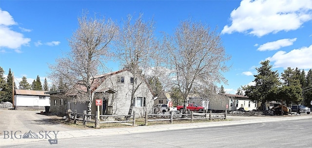 view of front of property with fence private yard and a residential view