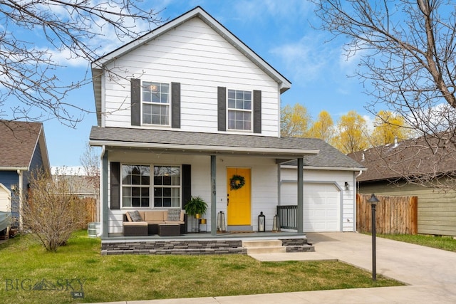 traditional-style house featuring fence, driveway, covered porch, a front yard, and a garage