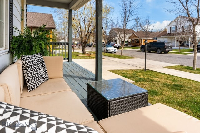 exterior space with a porch and a residential view