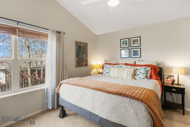 carpeted bedroom with ceiling fan, lofted ceiling, and baseboards