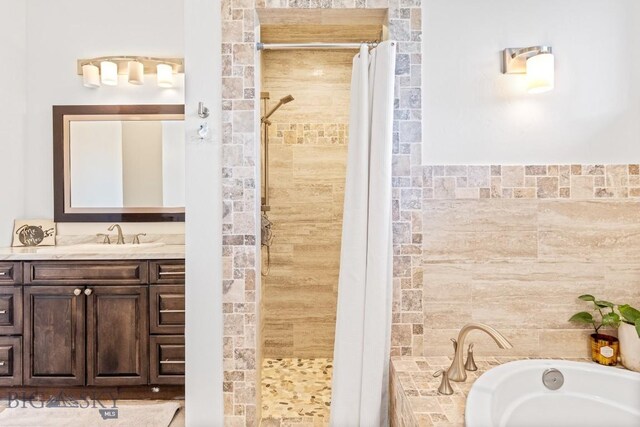 31 Haystack Dr, Bozeman, MT 59718 - bathroom featuring a bath, a tile shower, and vanity