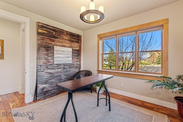 31 Haystack Dr, Bozeman, MT 59718 - office space with wood finished floors, baseboards, and an inviting chandelier