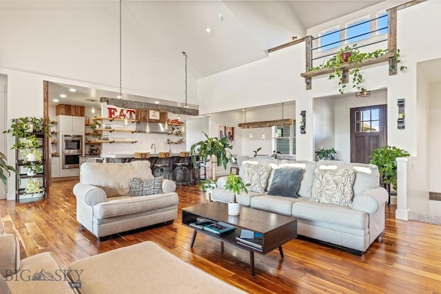 31 Haystack Dr, Bozeman, MT 59718 - living area featuring light wood-style floors, a wealth of natural light, and a towering ceiling