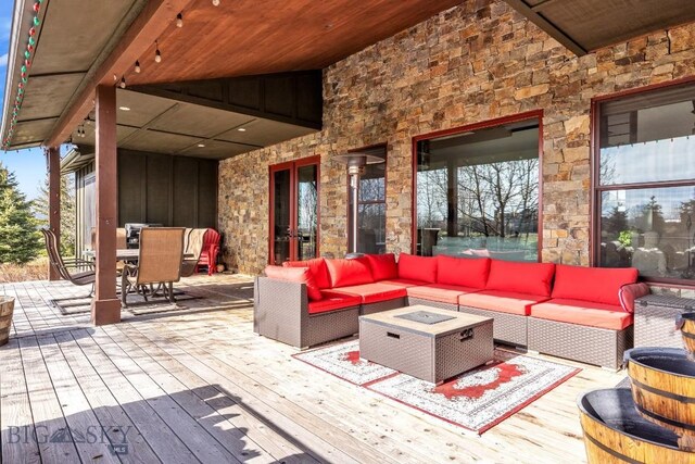 31 Haystack Dr, Bozeman, MT 59718 - exterior space featuring a wooden deck, outdoor dining area, and an outdoor living space with a fire pit