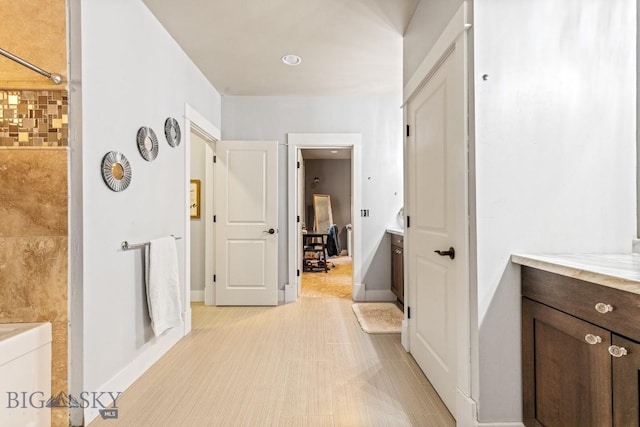 31 Haystack Dr, Bozeman, MT 59718 - full bathroom featuring baseboards, vanity, and a washtub