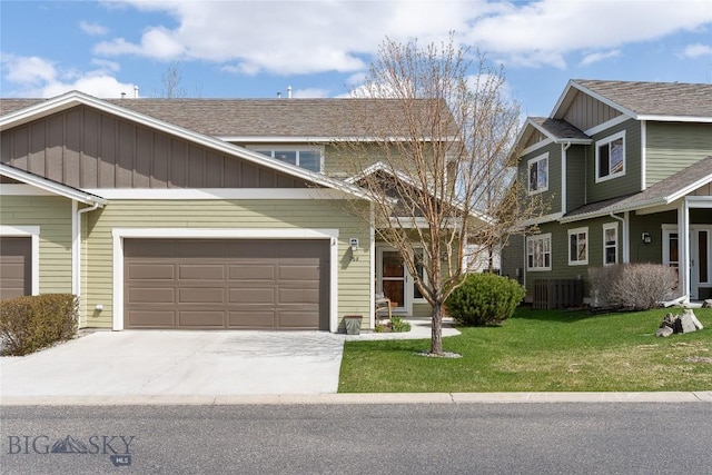 268 Pine Creek Dr, Bozeman, MT 59718 - craftsman-style house featuring a shingled roof, a front lawn, an attached garage, board and batten siding, and driveway