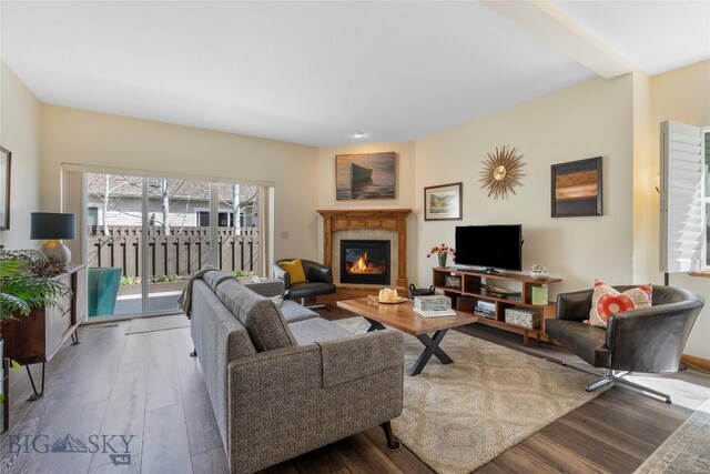 268 Pine Creek Dr, Bozeman, MT 59718 - living area with a glass covered fireplace and wood finished floors