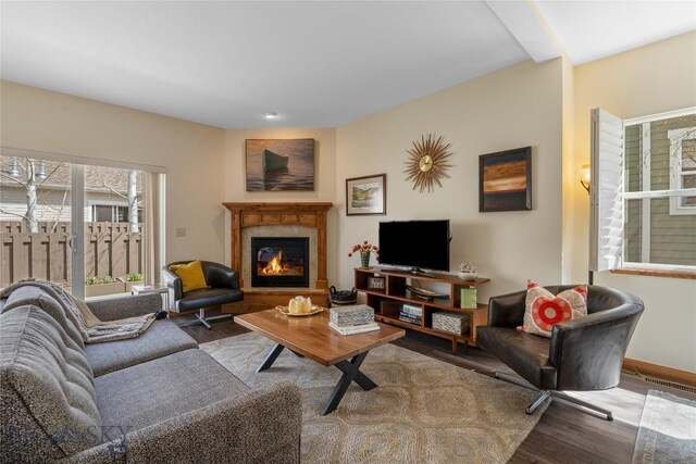 268 Pine Creek Dr, Bozeman, MT 59718 - living room featuring baseboards, a tile fireplace, and wood finished floors