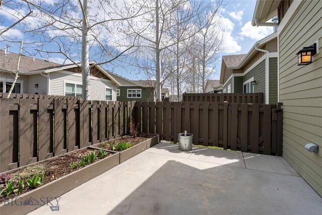 268 Pine Creek Dr, Bozeman, MT 59718 - view of patio / terrace featuring fence and a residential view