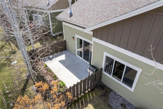 268 Pine Creek Dr, Bozeman, MT 59718 - exterior space featuring board and batten siding, a patio area, fence, and roof with shingles