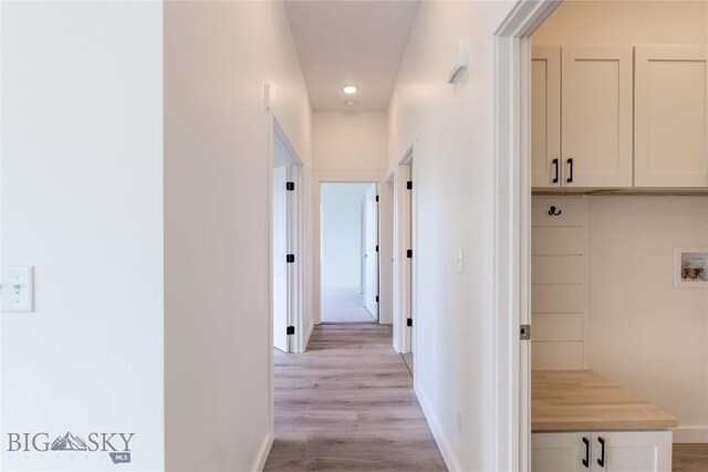 209 Pearl St, Ennis, MT 59729 - corridor featuring light wood-style floors, baseboards, and recessed lighting