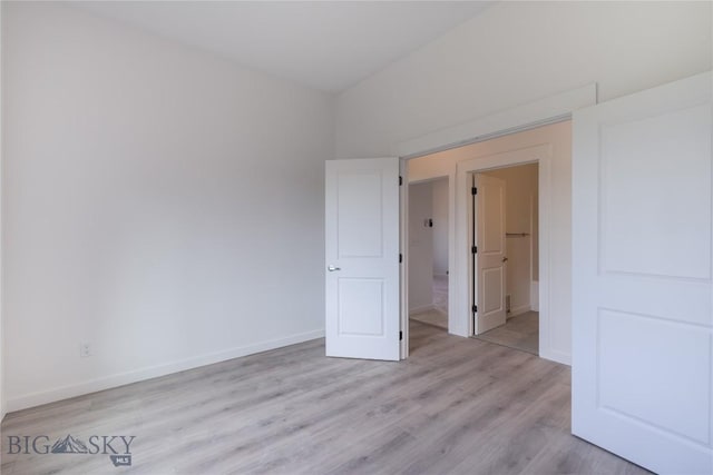 209 Pearl St, Ennis, MT 59729 - unfurnished bedroom featuring light wood-style floors and baseboards
