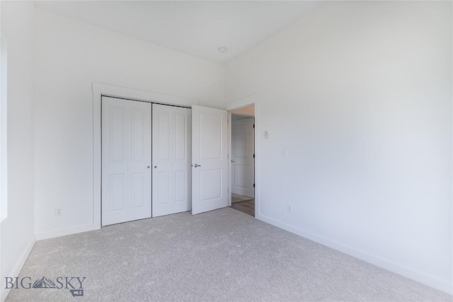 209 Pearl St, Ennis, MT 59729 - unfurnished bedroom featuring carpet floors, baseboards, and a closet