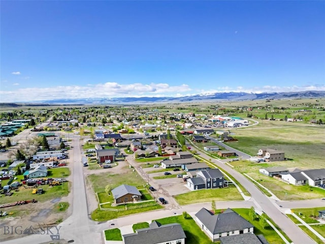 209 Pearl St, Ennis, MT 59729 - aerial perspective of suburban area featuring mountains