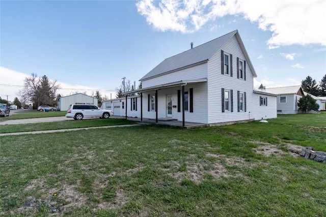 602 Harris, Big Timber, MT 59011 - country-style home featuring a porch, metal roof, and a front yard