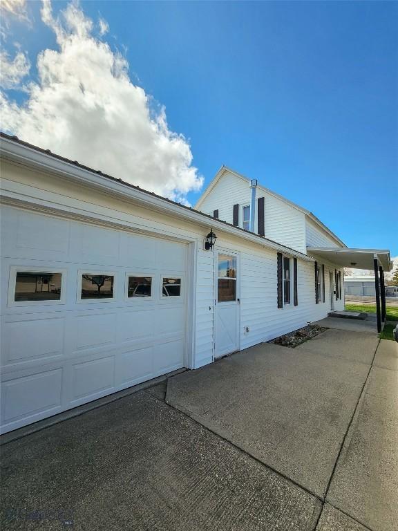 602 Harris, Big Timber, MT 59011 - view of property exterior with an attached garage and driveway