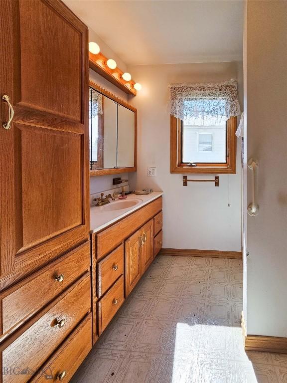 602 Harris, Big Timber, MT 59011 - bathroom with tile patterned floors, baseboards, and vanity