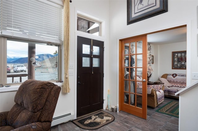 682 E River Rd, Pray, MT 59065 - foyer featuring a baseboard heating unit and a high ceiling