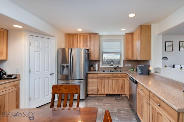 682 E River Rd, Pray, MT 59065 - kitchen featuring stainless steel appliances, a sink, recessed lighting, tasteful backsplash, and light countertops