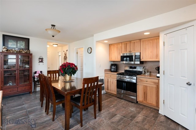 682 E River Rd, Pray, MT 59065 - kitchen with appliances with stainless steel finishes, light brown cabinetry, light countertops, recessed lighting, and decorative backsplash