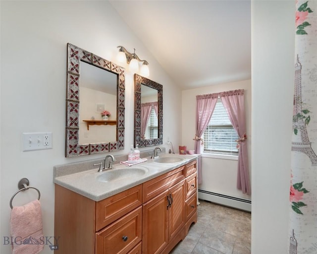 682 E River Rd, Pray, MT 59065 - bathroom with a baseboard heating unit, lofted ceiling, and double vanity