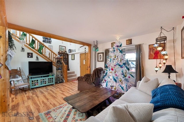 682 E River Rd, Pray, MT 59065 - living room featuring wood finished floors and stairs
