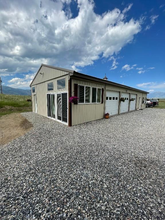682 E River Rd, Pray, MT 59065 - garage with gravel driveway