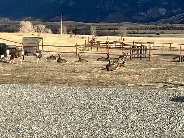 682 E River Rd, Pray, MT 59065 - view of yard with a view of countryside, fence, and a mountain view