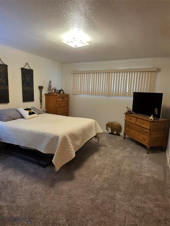 606 S Arizona, Dillon, MT 59725 - carpeted bedroom with a textured ceiling