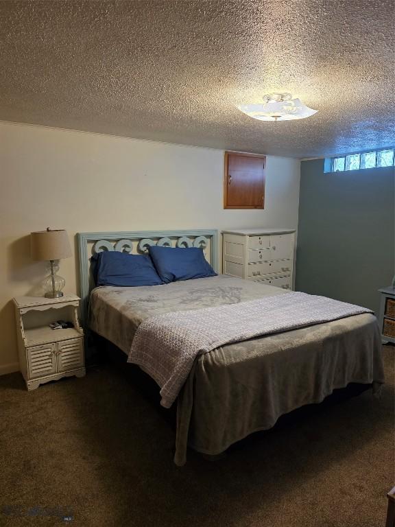 606 S Arizona, Dillon, MT 59725 - carpeted bedroom featuring a textured ceiling