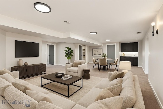 1413 Cherry Dr, Bozeman, MT 59715 - living room featuring light colored carpet, recessed lighting, and built in features