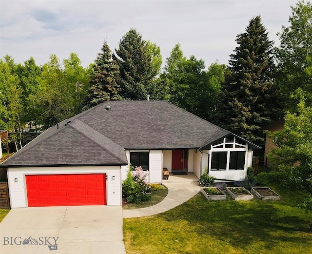 1413 Cherry Dr, Bozeman, MT 59715 - view of front facade featuring a front yard, an attached garage, roof with shingles, and driveway