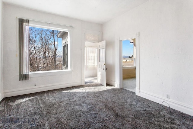 797 Hornet, Butte, MT 59701 - unfurnished bedroom with carpet, connected bathroom, and baseboards