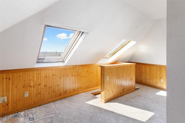 797 Hornet, Butte, MT 59701 - bonus room featuring lofted ceiling with skylight, wooden walls, a wainscoted wall, and carpet flooring