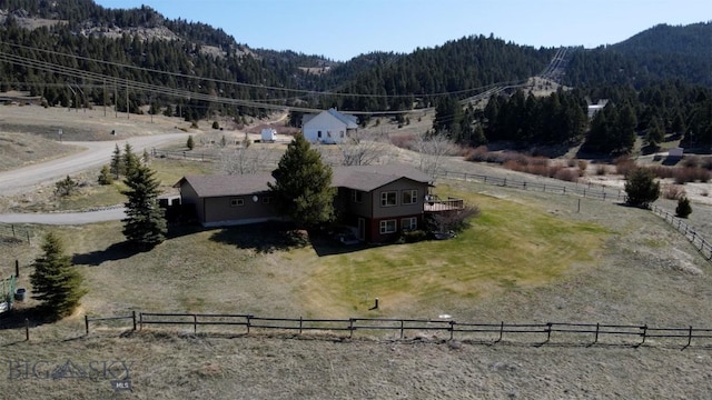 drone / aerial view featuring a rural view, a mountain view, and a forest view
