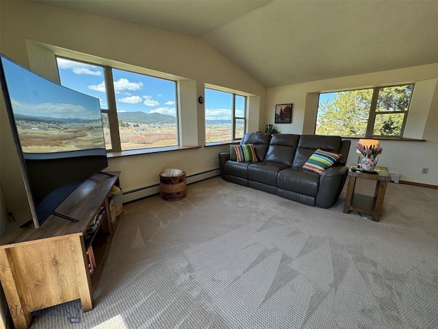 living area with vaulted ceiling, a baseboard heating unit, and carpet floors