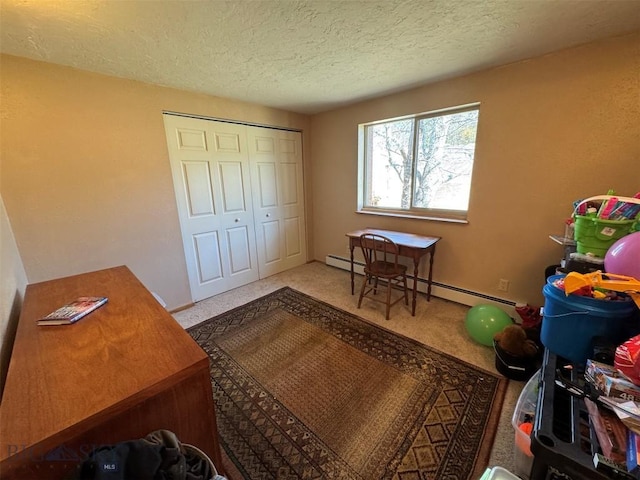interior space with a textured ceiling and a baseboard radiator