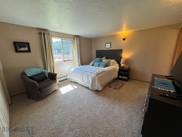 bedroom with a textured ceiling, baseboards, carpet, and a baseboard radiator