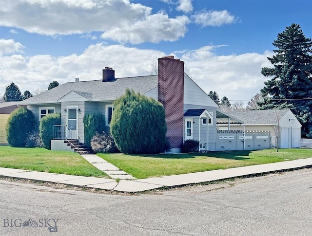 view of front of home with fence, a chimney, and a front yard