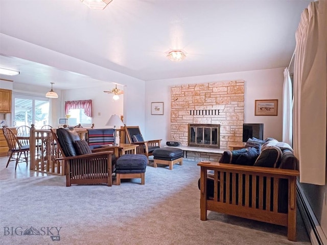 carpeted living area featuring a fireplace