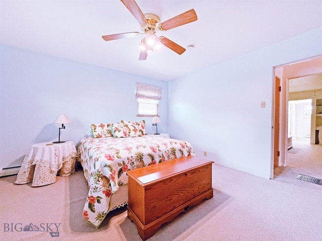 carpeted bedroom with a ceiling fan and visible vents