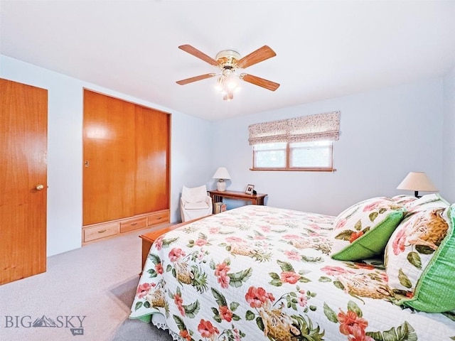 bedroom featuring ceiling fan and carpet