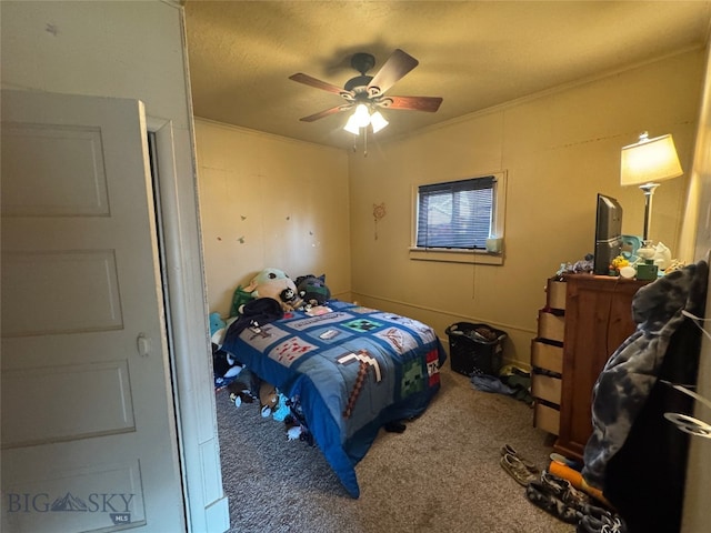 bedroom with ornamental molding, a ceiling fan, and carpet floors