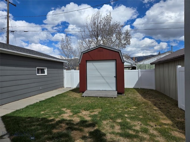 view of shed featuring a fenced backyard