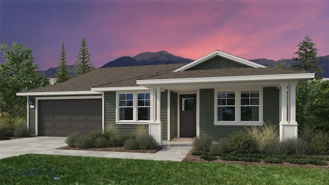 1520 Cyril Way, Belgrade, MT 59714 - ranch-style house with a garage, a mountain view, driveway, and covered porch