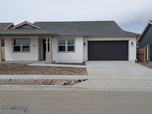 1520 Cyril Way, Belgrade, MT 59714 - single story home featuring an attached garage, roof with shingles, and concrete driveway