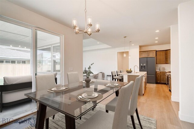 1520 Cyril Way, Belgrade, MT 59714 - dining space featuring light wood-style flooring, recessed lighting, and a chandelier