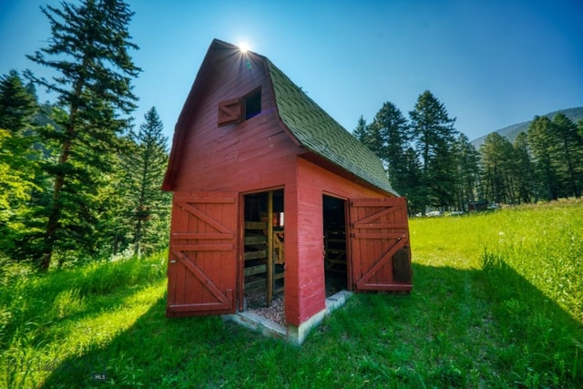 14470 Cottonwood Canyon Rd, Bozeman, MT 59718 - view of barn with a lawn and a forest view
