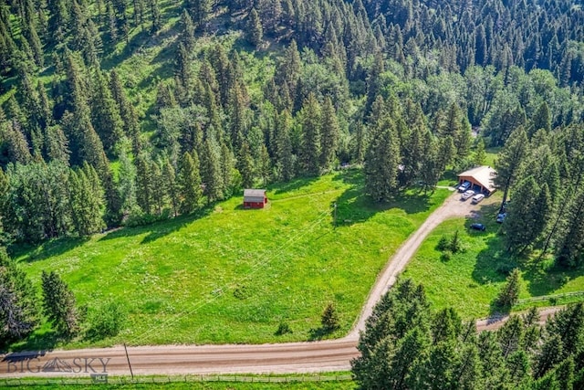 14470 Cottonwood Canyon Rd, Bozeman, MT 59718 - drone / aerial view featuring a wooded view